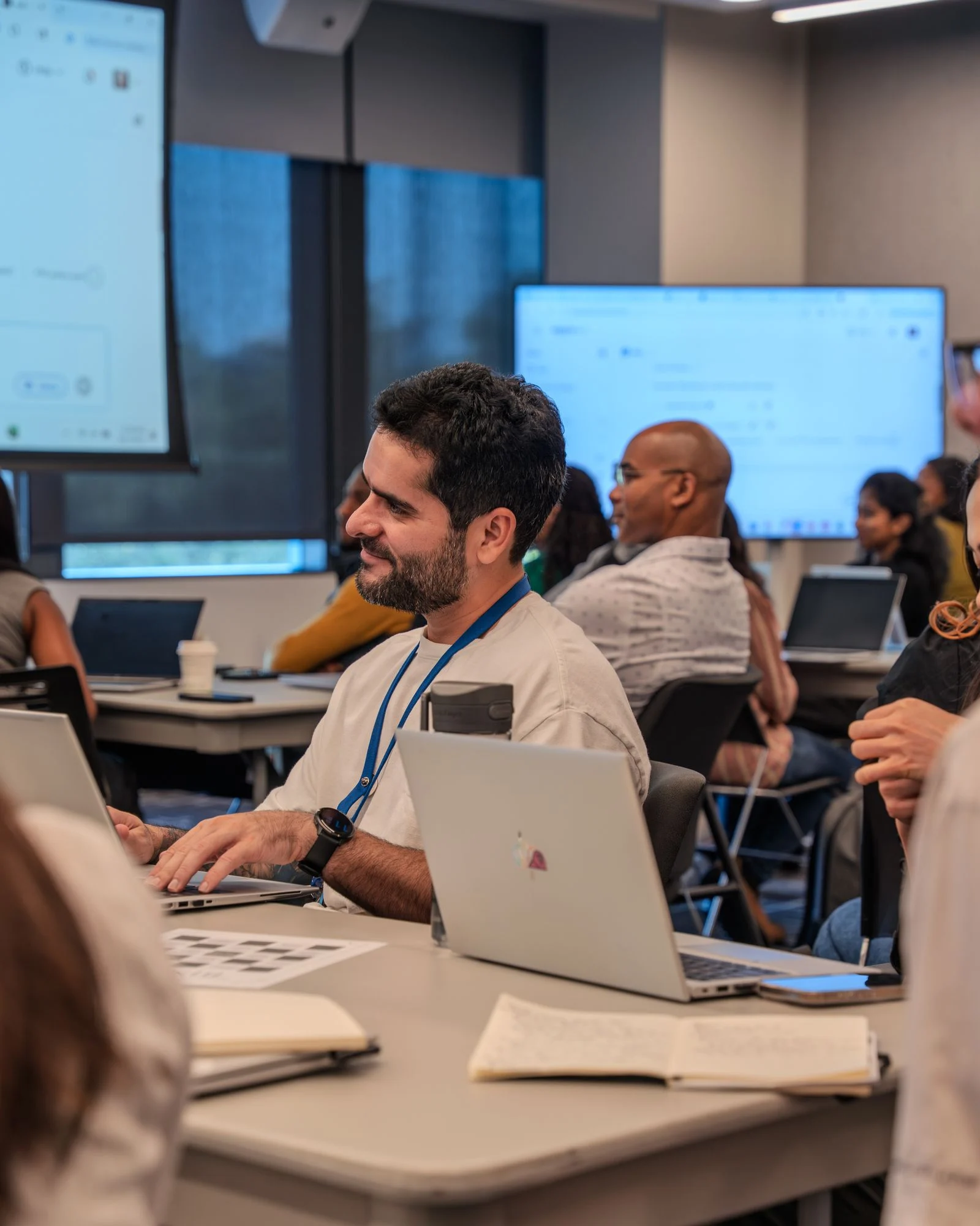 Diverse participants collaborating in a technology training workshop